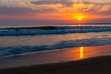 Obraz premium Image of summer sunny ocean waves and sunset in colorful tones