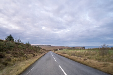Road with Scenic Landscape View of Mountain, Forest in Scottish Highlands. Concept of Road trip, vacation.