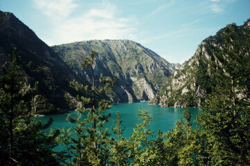 Fototapeta na wymiar MONTENEGRO: Scenic landscape view of the fjord with mountains and blue water 