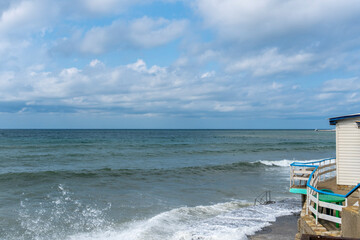 small storm on the sea, waves hitting the shore