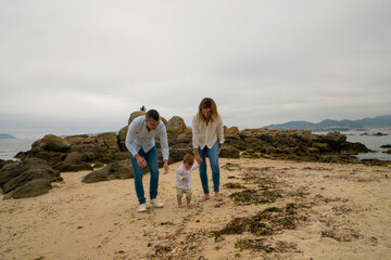 Happy family and child on beach