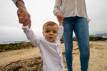 Baby walking on beach