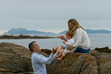 Happy family and child on beach