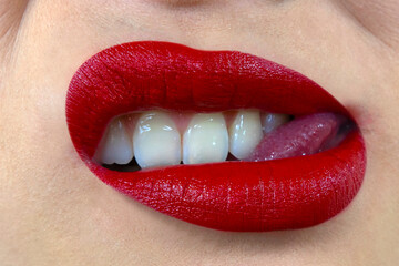 Sexy, sensual mouth with red lipstick and white teeth