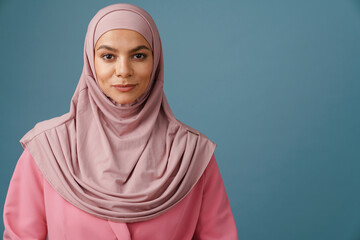 Young muslim woman in hijab posing and looking at camera