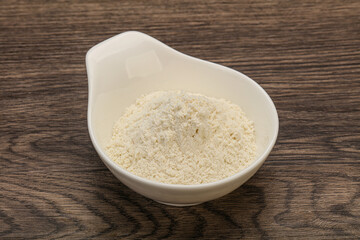 Wheat flour heap in the bowl