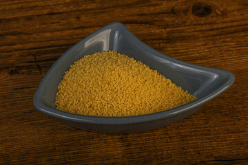 Raw cous cous heap in the bowl