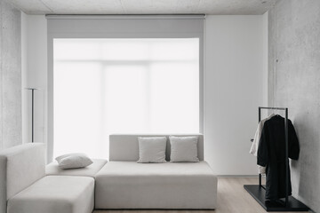 White sofa in room with panoramic window