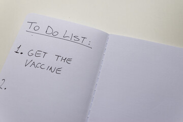 Blank diary page, with text "To do list" and "get the vaccine". Administration of vaccines; need to be vaccinated voluntarily. Green pass. 