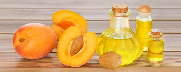 Apricot kernel oil on wooden  background