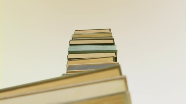 Growing stack of books. Education, erudition and self-training concept. 
