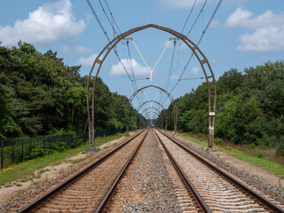 Railroad catenary portals in Hilversum, the Netherlands. National monument with cultural-historical and typological value