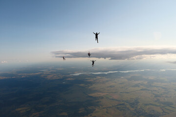 Fototapeta premium Freefly skydiving. Fun jump. Skydivers are flying in the sky.