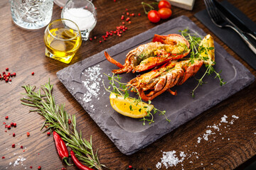 Lobster with flavored butter. Herb butter, lemon. Delicious healthy traditional food closeup served for lunch in modern gourmet cuisine restaurant