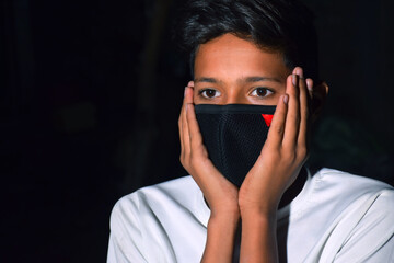 13 years old Asian cute boy wearing protective mask, prevention of Corona virus (Covid -19) and...