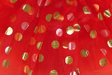 Red tulle fabric with golden polka dots - obrazy, fototapety, plakaty