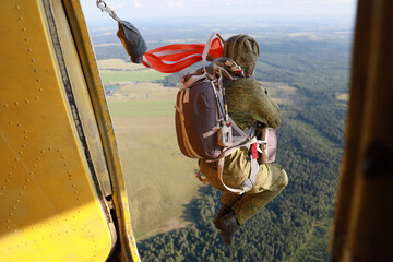 Paratrooper. A jumping out of a plane.