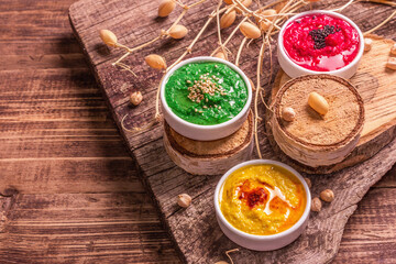 Chickpea hummus backdrop, assorted flavor on vintage wooden table