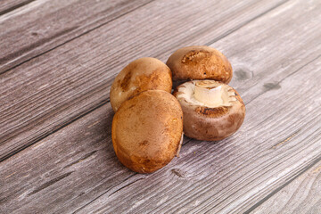 Raw brown champignons mushroom heap