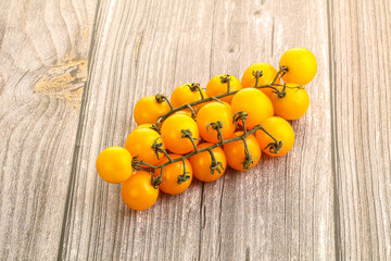 Branch with yellow cherry tomato