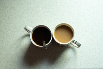 a cup of coffee for breakfast on a light background, a cup of coffee on the table