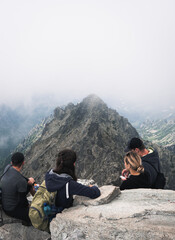 Naklejka premium a group of tourists is resting after climbing the highest point in Poland. Mount rysy 2499 meters