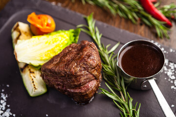 Black Angus Chateaubriant steak. Tenderloin from Brazil. Delicious healthy traditional food closeup served for lunch in modern gourmet cuisine restaurant