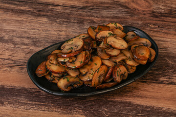 Roasted champignon with herbs and spices