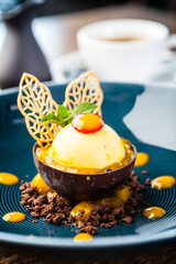 Mango, apple, cream cheese, passionfruit dessert. Delicious healthy traditional food closeup served for lunch in modern gourmet cuisine restaurant