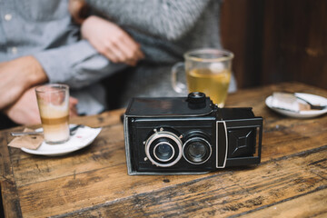 Vintage video camera on wooden table