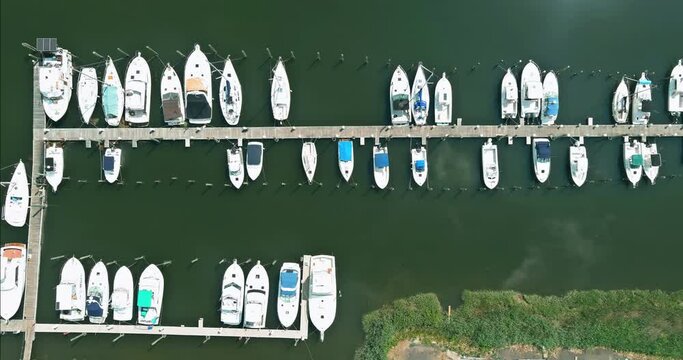Aerial view boats in little port in ocean a little marina along the dockside