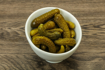 Pickled gherkin in the bowl