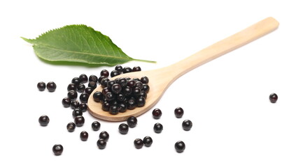 Elderberries, elder berries pile with green leaf and wooden spoon, isolated on white background
