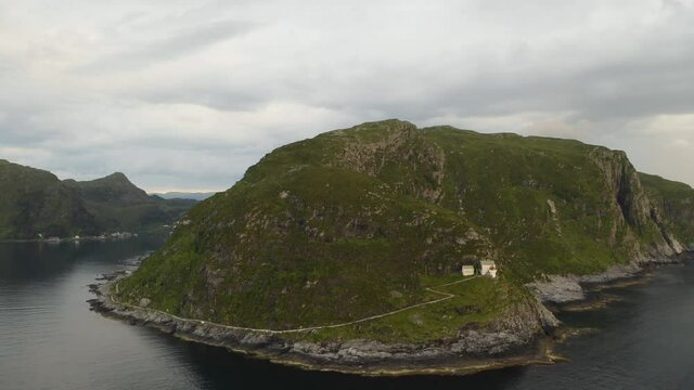 Aerial View Of Road On Rugged Mountain Leading To Hendanes Lighthouse In The Town Of Maloy, Near The Island Of Vagsoy In Norway.