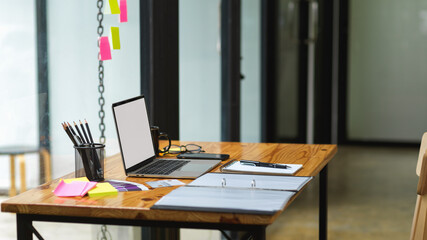 Content creator working desk with empty screen laptop, content idea on sticky notes