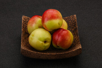 Sweet small nectarines in the basket