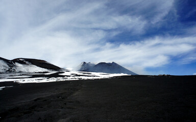 Hike Mount Etna, the highest active volcano in Europe.
