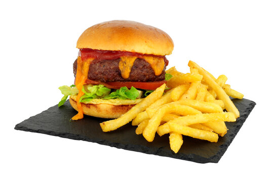 Cheeseburger and French fries in a brioche bread roll on a slate serving board - Powered by Adobe