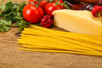 Raw Italian spaghetti heap with cheese
