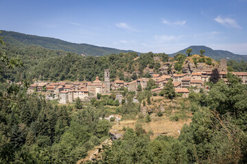 Fototapeta na wymiar Medieval architecture street of Rupit Village in Catalonia, Osona. Aerial view. Medieval village among mountains.