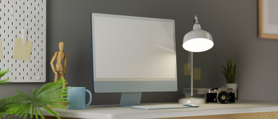 Home office space in stylish design, with blank screen computer and decor, grey wallpaper, 3d rendering