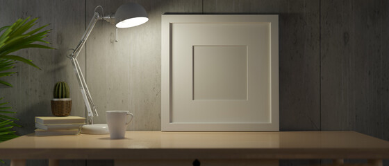 At night, white frame mock up with  light from table lamp on the desk