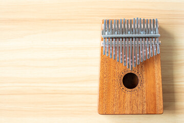 Acoustic wooden kalimba music instrument on wood table background
