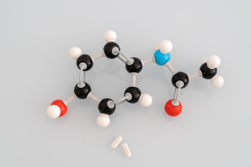 Isolated molecular model of paracetamol with two pills of paracetamol 650