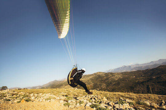 Paraglider is on the paraplane strops - soaring flight moment