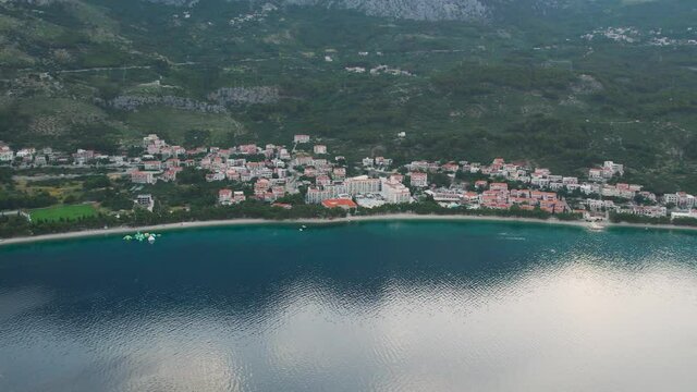 CROATIA - Cirka 2020s - Beautiful aerial over the Tucepi coast, Makarska riviera in the morning. Sea side view