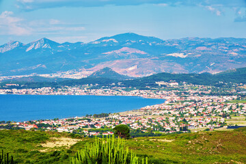 Fototapeta na wymiar Panoramic view of Urla town, sea, sky, mountains and buildings in İzmir, Turkey