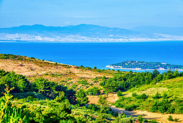 Fototapeta na wymiar Panoramic view of Urla town, sea, sky, mountains and buildings in İzmir, Turkey