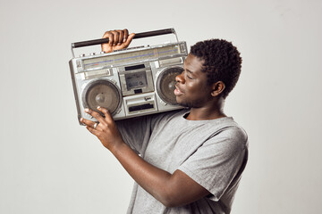 man of african appearance tape recorder in hands music nostalgia
