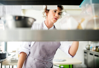 Closeup of kitchen staff prepare cooking ingredients